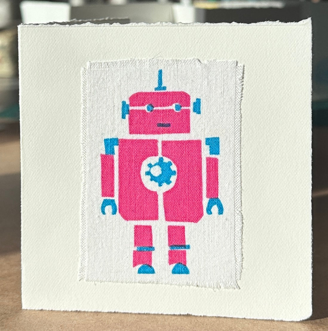 Pink Robot with blue highlights.