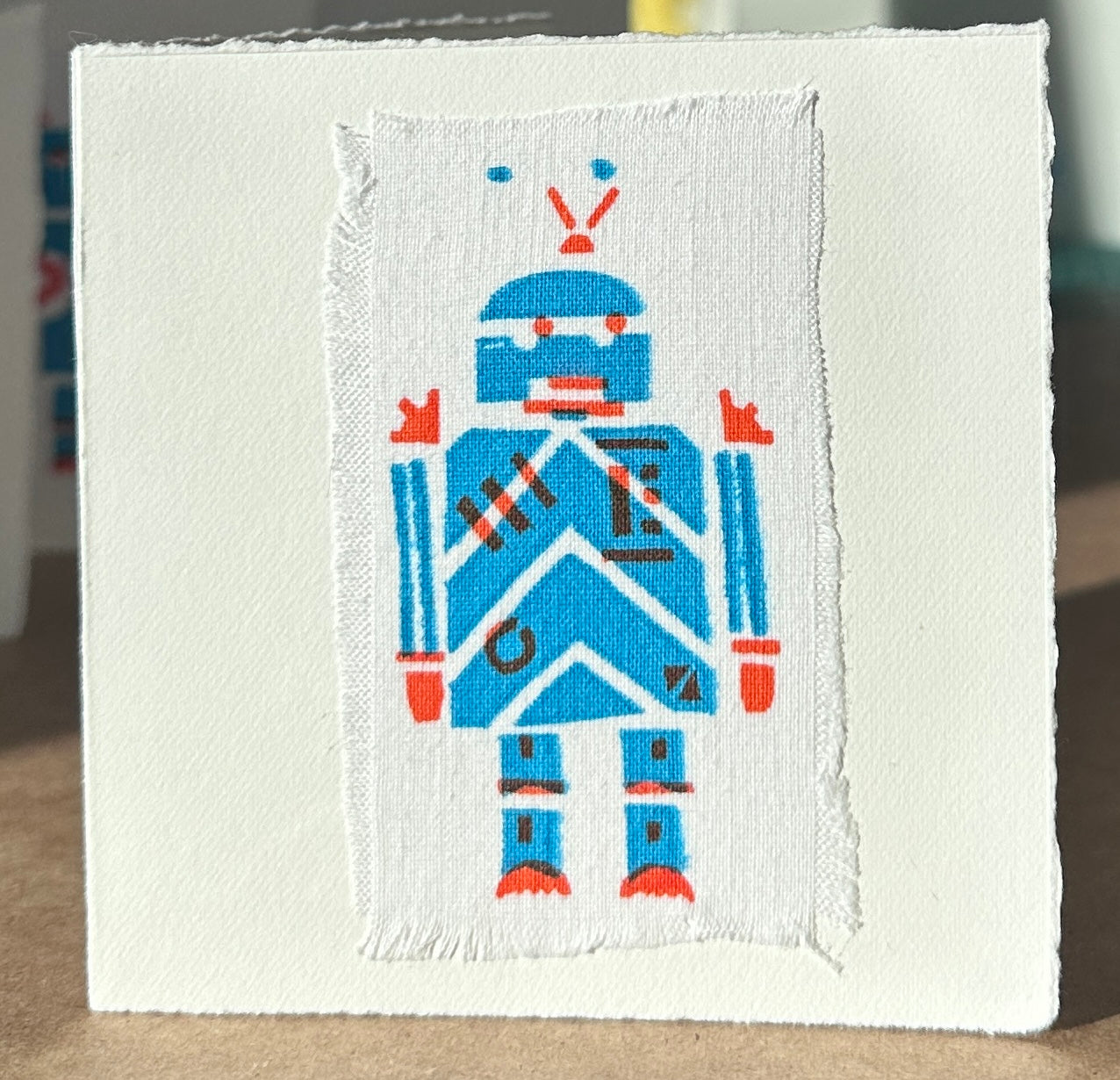 Blue Robot with orange highlights.