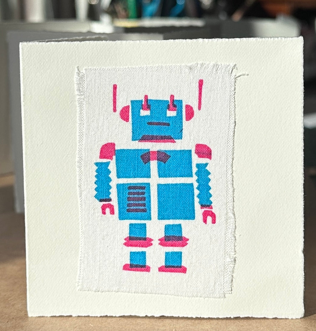 Blue Robot with pink highlights.