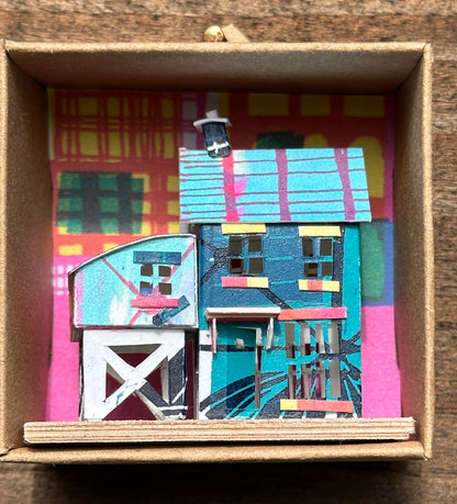 olourful blue and pink house with curved roof extension in presentation box